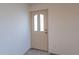 Interior shot of entryway with front door, tile flooring, and white walls at 7531 W Kimberly Way, Glendale, AZ 85308