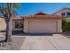 Single Gathering house featuring two car garage, desert landscaping, and red tiled roof at 7531 W Kimberly Way, Glendale, AZ 85308