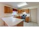 The kitchen has stainless steel appliances, wood cabinetry, and tile backsplash at 7531 W Kimberly Way, Glendale, AZ 85308