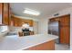 Kitchen features a breakfast bar, stainless appliances, and wood cabinetry at 7531 W Kimberly Way, Glendale, AZ 85308