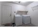 This laundry area features a washer and dryer at 7531 W Kimberly Way, Glendale, AZ 85308