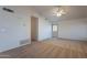 Open living room space featuring carpet flooring and view into entryway at 7531 W Kimberly Way, Glendale, AZ 85308