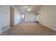 Spacious living room featuring carpet floors, high ceilings and glass doors at 7531 W Kimberly Way, Glendale, AZ 85308