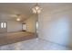 Open living area with a ceiling fan, view of french doors and adjacent dining area at 7531 W Kimberly Way, Glendale, AZ 85308