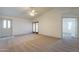 Living room featuring carpet floors, high ceilings and view of entryway at 7531 W Kimberly Way, Glendale, AZ 85308