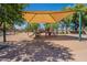 Playground with slides and climbing structures offering safe play under a shaded canopy at 7531 W Kimberly Way, Glendale, AZ 85308