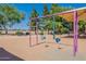 Swing set on the playground with shade and nearby benches at 7531 W Kimberly Way, Glendale, AZ 85308