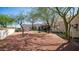 Expansive backyard featuring desert landscaping, mature trees, and a well-maintained exterior at 8540 E Mcdowell Rd # 116, Mesa, AZ 85207