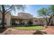 Large backyard with artificial turf, patio, and desert landscaping at 8540 E Mcdowell Rd # 116, Mesa, AZ 85207