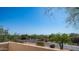 Picturesque view from balcony showcases charming neighborhood and distant mountain backdrop at 8540 E Mcdowell Rd # 116, Mesa, AZ 85207
