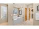 Relaxing bathroom showcasing a luxurious bathtub with window views, complemented by a closet, for a spa-like experience at 8540 E Mcdowell Rd # 116, Mesa, AZ 85207