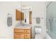 Cozy bathroom featuring a single sink vanity, ample cabinet space, and a shower with a glass door at 8540 E Mcdowell Rd # 116, Mesa, AZ 85207