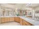 Bright bathroom featuring a double vanity, marble countertop and ample mirror space, exuding elegance and functionality at 8540 E Mcdowell Rd # 116, Mesa, AZ 85207