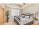 Comfortable bedroom showcasing a bed, shuttered windows, and a stylish plant, perfect for a tranquil resting space at 8540 E Mcdowell Rd # 116, Mesa, AZ 85207