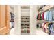 Walk-in closet with custom shelving, ample hanging space, and organized storage solutions at 8540 E Mcdowell Rd # 116, Mesa, AZ 85207