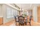 Charming dining area featuring wood floors, a decorative chandelier, and custom built-in cabinets at 8540 E Mcdowell Rd # 116, Mesa, AZ 85207