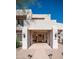 Inviting home entrance showcasing grand columns, stone walkway, and a stylish front door at 8540 E Mcdowell Rd # 116, Mesa, AZ 85207