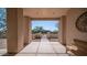 Inviting entry with view of private gate framed by desert landscape and a cozy bench for relaxation at 8540 E Mcdowell Rd # 116, Mesa, AZ 85207