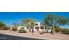 Beautiful home featuring desert landscaping, native vegetation, and mature trees at 8540 E Mcdowell Rd # 116, Mesa, AZ 85207