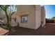 The exterior of this property features a neutral stucco facade and a well-maintained yard with desert landscaping at 8540 E Mcdowell Rd # 116, Mesa, AZ 85207