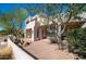 A stunning two-story home with desert landscaping, including mature trees and native vegetation at 8540 E Mcdowell Rd # 116, Mesa, AZ 85207