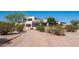 Expansive desert home with lush trees and gravel driveway for natural curb appeal at 8540 E Mcdowell Rd # 116, Mesa, AZ 85207