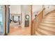 Elegant foyer boasting wood flooring, a staircase, and an open view into the living room at 8540 E Mcdowell Rd # 116, Mesa, AZ 85207