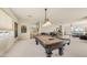 Entertain in this game room with pool table, built in bar, and abundant natural light at 8540 E Mcdowell Rd # 116, Mesa, AZ 85207
