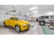 Spacious three car garage featuring ample lighting and room for storage at 8540 E Mcdowell Rd # 116, Mesa, AZ 85207