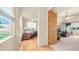 Hallway view showcases the home office and primary bedroom with a nice flow and open feel at 8540 E Mcdowell Rd # 116, Mesa, AZ 85207