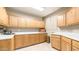 Well organized laundry room with plenty of cabinet space and a bright, clean aesthetic at 8540 E Mcdowell Rd # 116, Mesa, AZ 85207