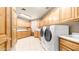 Well-equipped laundry room with modern appliances, ample cabinetry, and a convenient layout at 8540 E Mcdowell Rd # 116, Mesa, AZ 85207