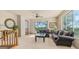 Bright living room featuring comfortable sofas, a large window, and tasteful decor, creating an inviting space at 8540 E Mcdowell Rd # 116, Mesa, AZ 85207