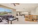 Spacious living room featuring a comfortable sofa, large window with mountain views, and seamless access to the billiards area at 8540 E Mcdowell Rd # 116, Mesa, AZ 85207