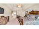 Spacious primary bedroom with a tray ceiling, sitting area, and lots of natural light at 8540 E Mcdowell Rd # 116, Mesa, AZ 85207