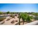 Scenic desert neighborhood view featuring lush vegetation and beautiful homes under a clear blue sky at 8540 E Mcdowell Rd # 116, Mesa, AZ 85207