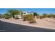 Desert landscaping surrounds this beautiful property, enhancing its curb appeal and natural setting at 8540 E Mcdowell Rd # 116, Mesa, AZ 85207