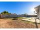 View of spacious backyard with block wall, pool, mature trees and abundant natural light at 9009 W Butler Dr, Peoria, AZ 85345