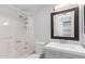 Hall bathroom with shower-tub combo, single sink vanity, and decorative framed mirror at 9009 W Butler Dr, Peoria, AZ 85345
