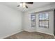 Bedroom featuring a ceiling fan and two windows at 9009 W Butler Dr, Peoria, AZ 85345