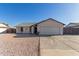 Charming single-story home with well-maintained landscaping, a two-car garage, and a welcoming facade at 9009 W Butler Dr, Peoria, AZ 85345