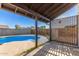 Inviting backyard pool and covered patio perfect for outdoor entertaining and relaxation at 9009 W Butler Dr, Peoria, AZ 85345
