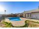 Backyard oasis featuring a refreshing pool, relaxing patio area, and private outdoor space at 9009 W Butler Dr, Peoria, AZ 85345