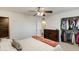Bright bedroom featuring a ceiling fan, closet, and wood dresser at 9214 N 54Th Ave, Glendale, AZ 85302