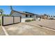 Charming home exterior showcasing a gated driveway and well-maintained landscaping at 9214 N 54Th Ave, Glendale, AZ 85302