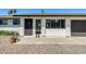 Close up of the front porch featuring white brick and desert landscaping at 9214 N 54Th Ave, Glendale, AZ 85302
