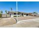 White brick single-story home featuring low maintenance landscaping and a RV gate at 9214 N 54Th Ave, Glendale, AZ 85302