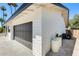 Attached garage showcasing a stylish door and ample parking space at 9214 N 54Th Ave, Glendale, AZ 85302