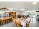 Open layout with kitchen island, stainless steel appliances, and dining area, creating an inviting space at 9214 N 54Th Ave, Glendale, AZ 85302