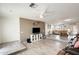 Bright living room featuring a tiled floor, white brick walls, and neutral decor at 9214 N 54Th Ave, Glendale, AZ 85302